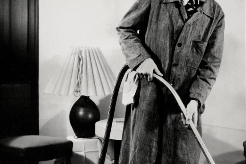 Person vacuuming a home floor